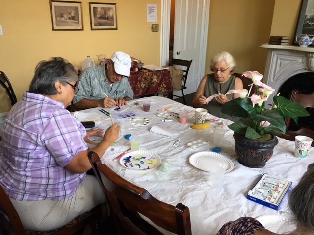seniors painting at the Woman's Club